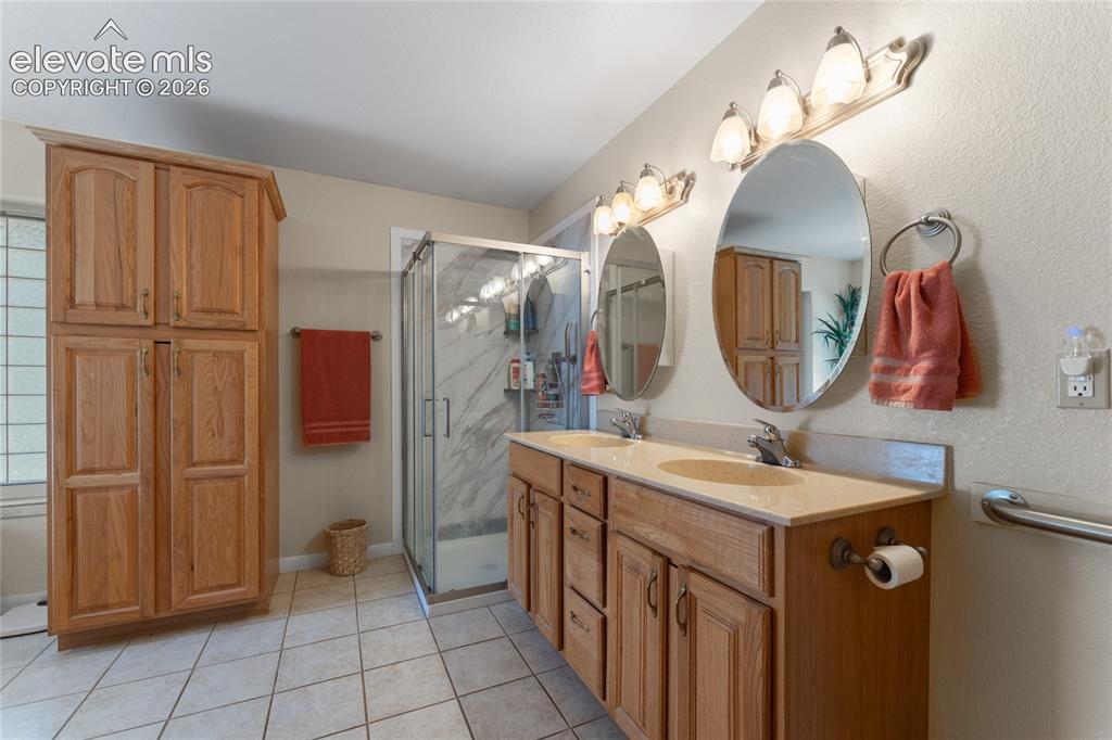 657 Spring Valley Drive Divide, CO 80814 - Photo 13 of 43 Dual vanity with integrated sinks and a light-toned countertop