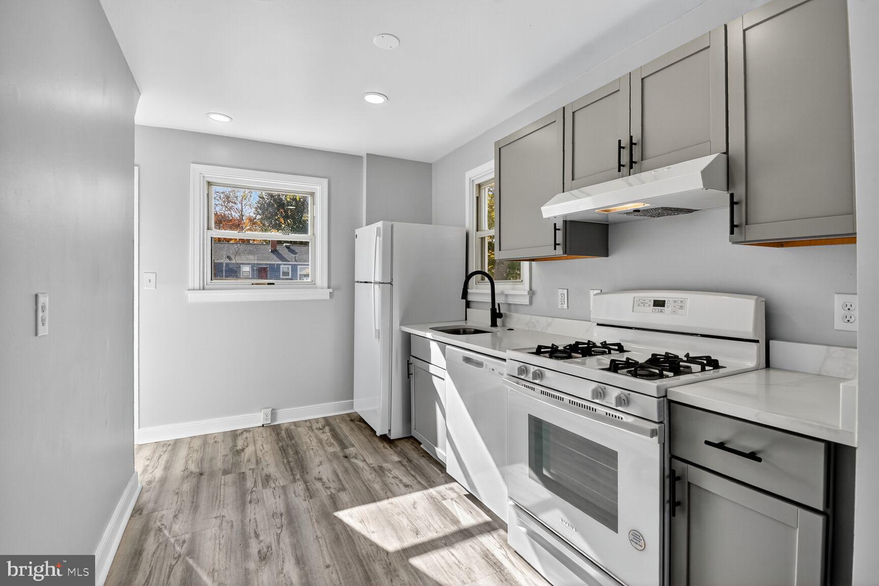 2814 Munson Street Silver Spring, MD 20902 - Photo 3 of 21 a kitchen with cabinets and steel stainless steel appliances