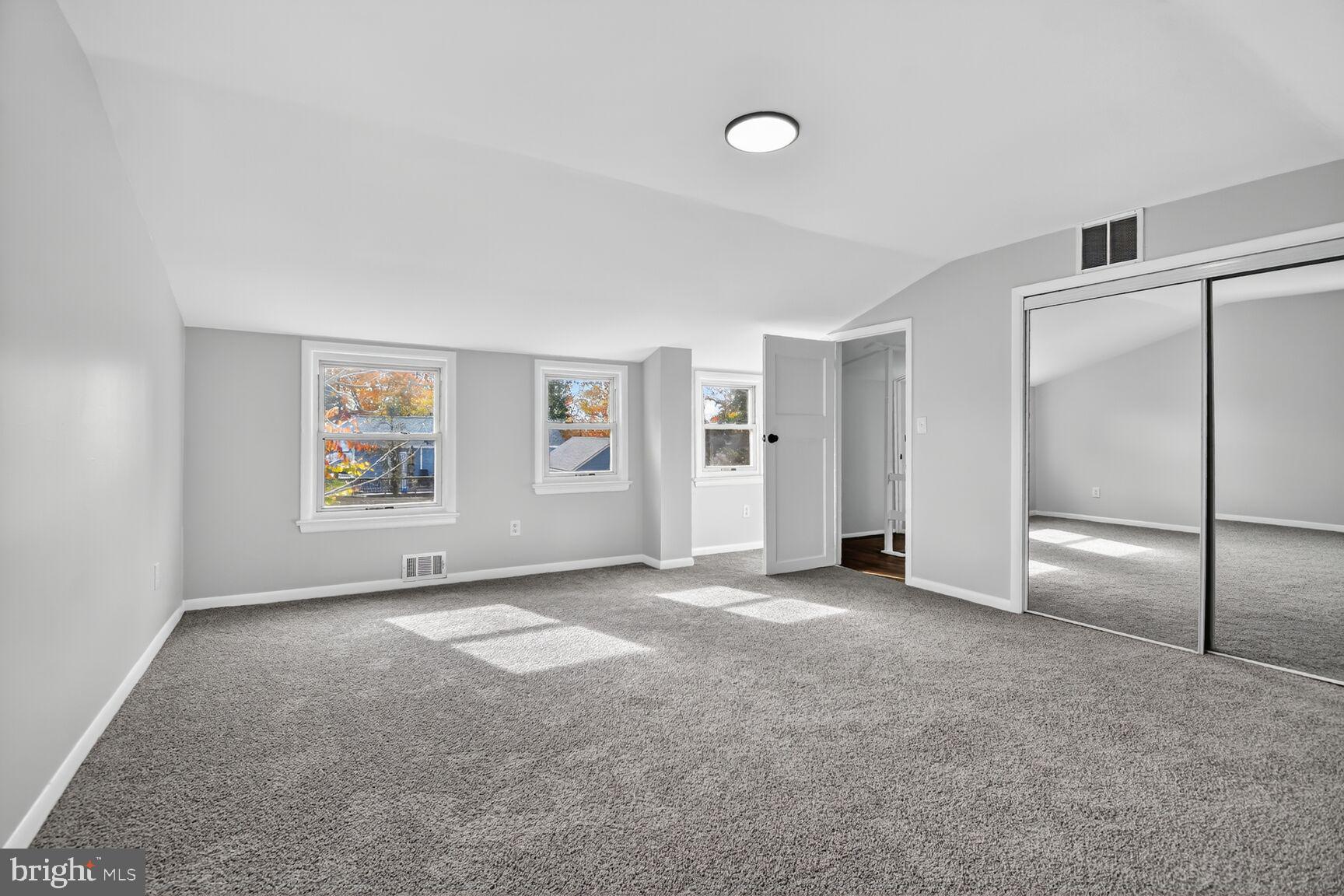 2814 Munson Street Silver Spring, MD 20902 - Photo 5 of 21 a view of empty room with windows and refrigerator