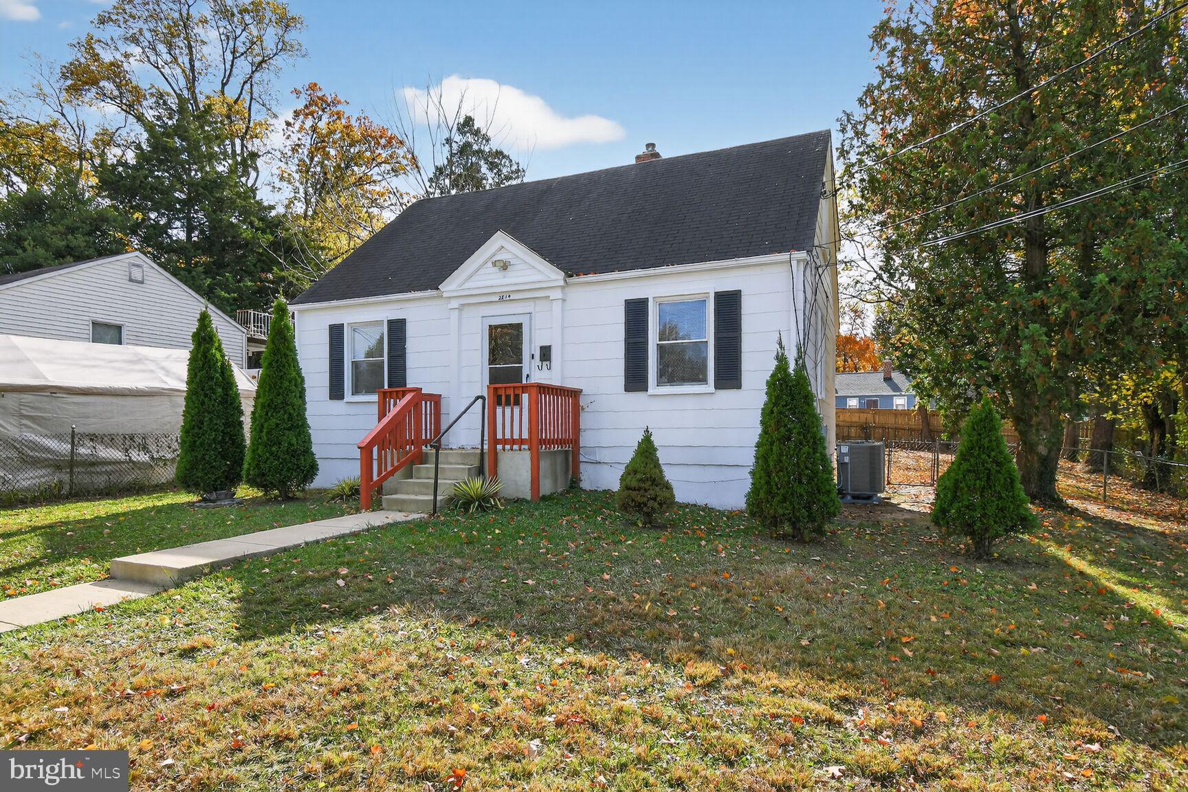 2814 Munson Street Silver Spring, MD 20902 - Photo 6 of 21 a front view of a house with a yard