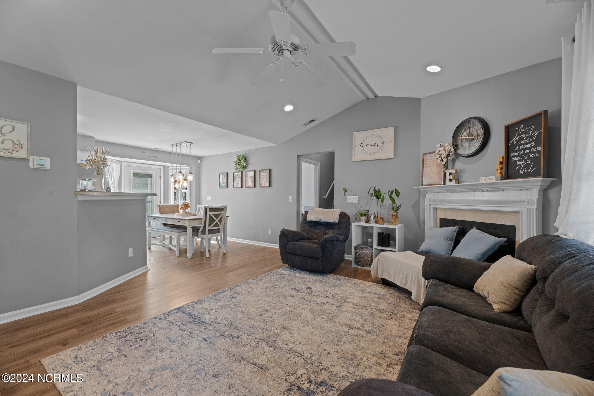 1116 Tebo Road New Bern, NC 28562 - Photo 5 of 37 living room with LVP flooring and cathedral ceiling
