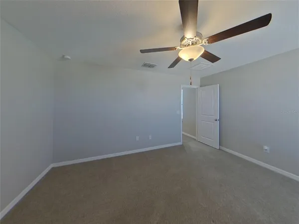 a view of a chandelier fan in a room