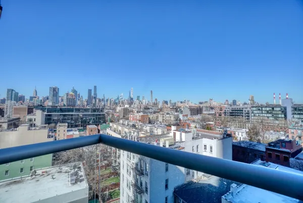 a view of a balcony with city view