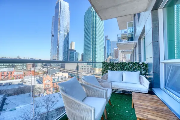 a view of a patio with couches and potted plants