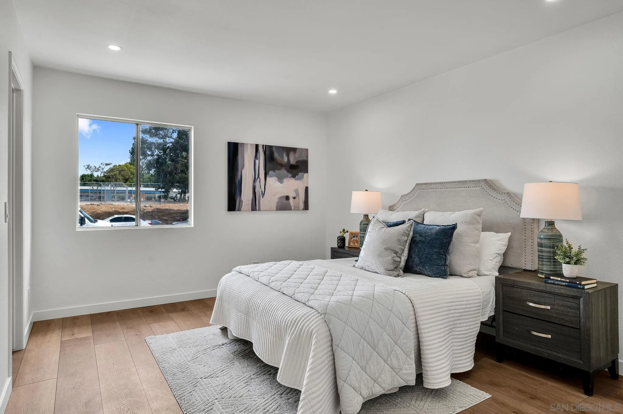 10235 Madrid Way, Unit 108 Spring Valley, CA 91977 - Photo 13 of 22 a bedroom with a bed and a window