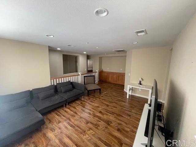 2207 Corte Anacapa Chula Vista, CA 91914 - Photo 13 of 22 a living room with furniture and a wooden floor