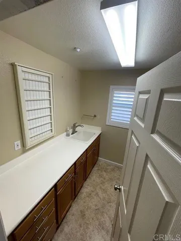 a bathroom with a sink a vanity and a bathtub