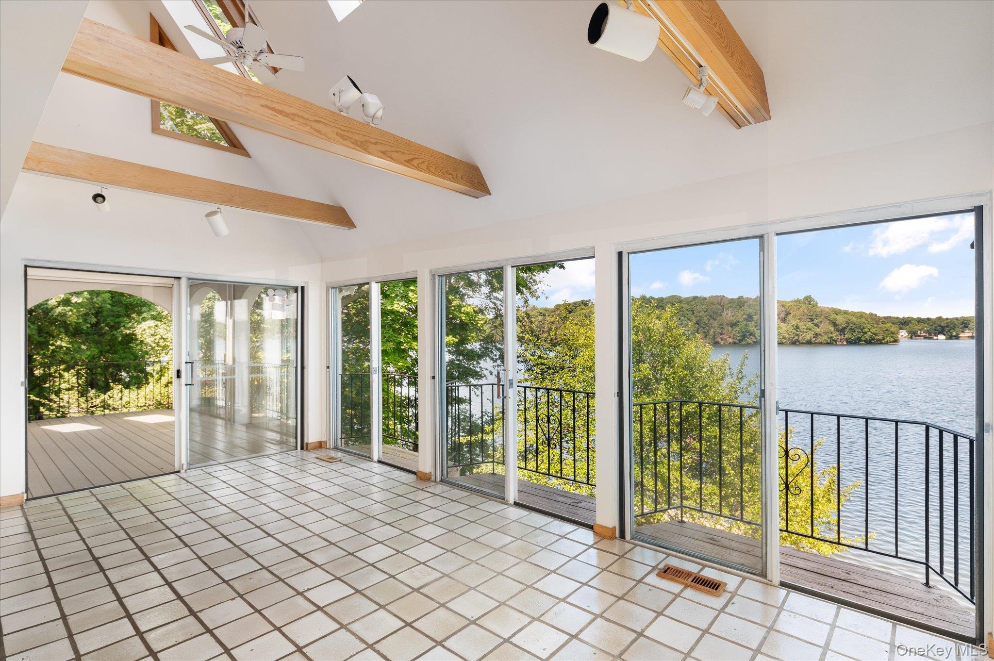 41 Tamarack Road Mahopac, NY 10541 - Photo 16 of 41 Open, light-filled living with Lake Mahopac always in view