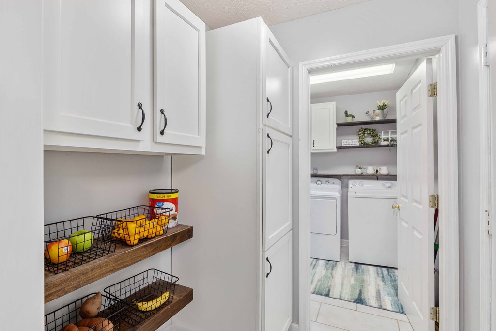 54 Waterford Drive Cataula, GA 31804 - Photo 21 of 25 a kitchen with stainless steel appliances granite countertop a refrigerator and a sink