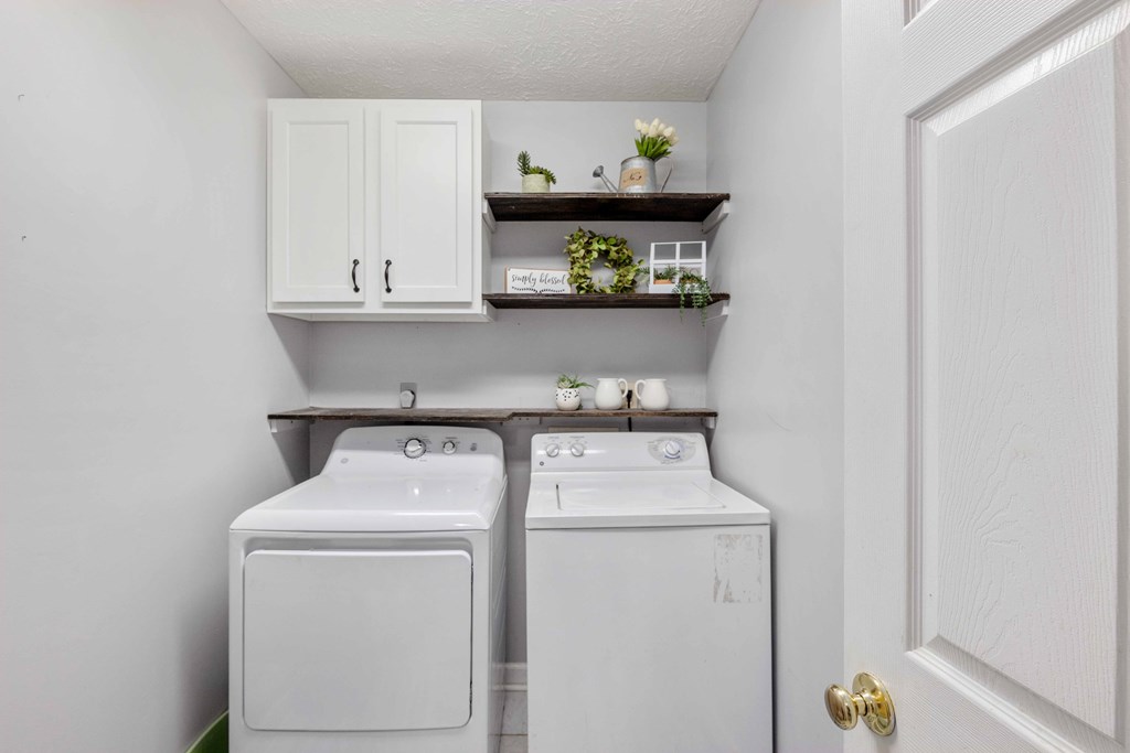 54 Waterford Drive Cataula, GA 31804 - Photo 22 of 25 a utility room with dryer and washer
