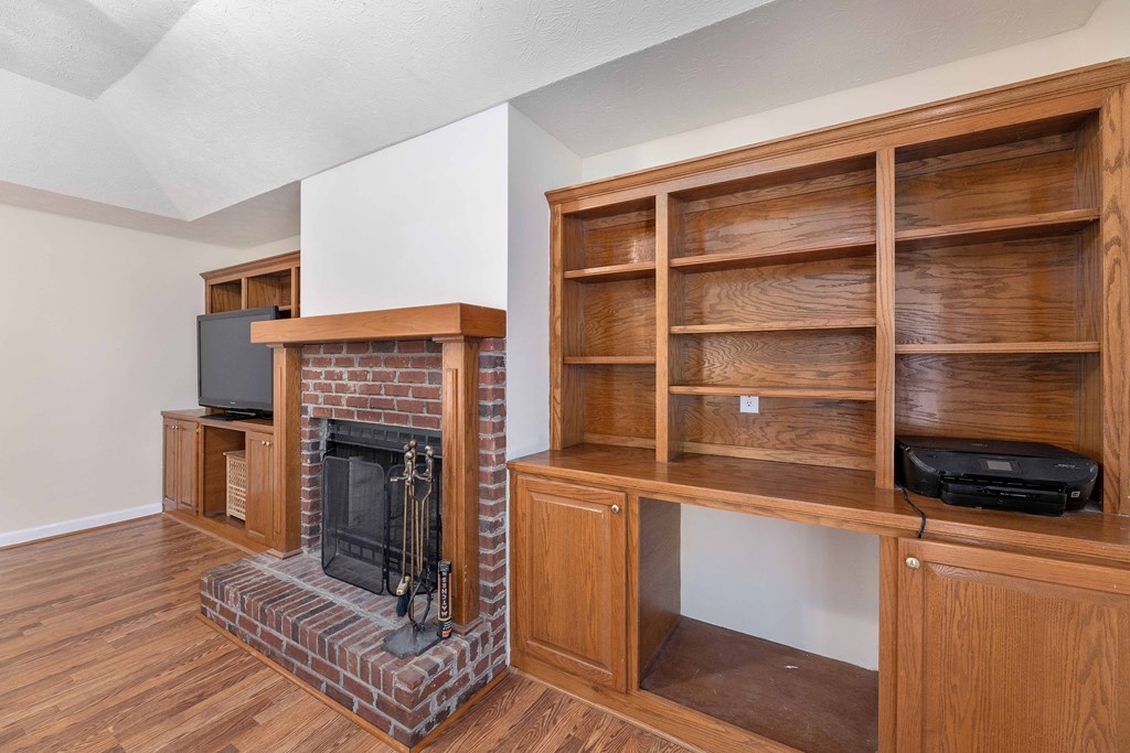 54 Waterford Drive Cataula, GA 31804 - Photo 4 of 25 a living room with furniture and a fireplace