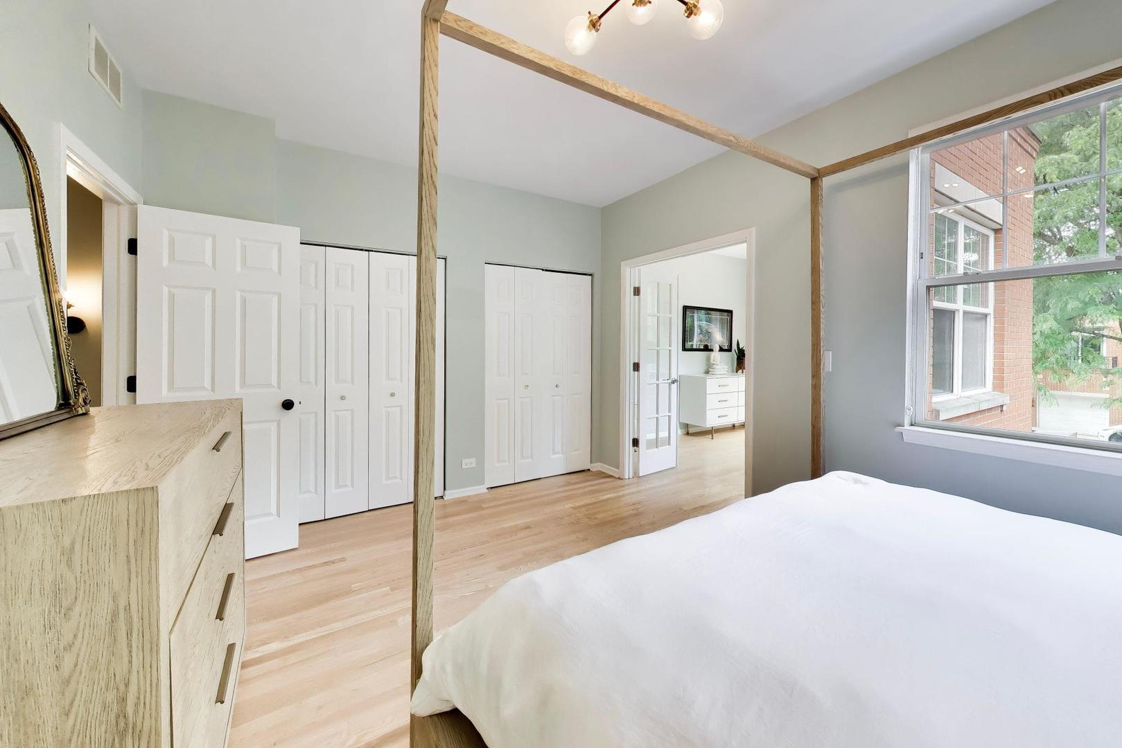 232 West Scott Street Chicago, IL 60610 - Photo 12 of 39 a bedroom with a large bed and a flat tv screen