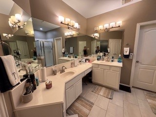 3110 Katner Lane Spring, TX 77386 - Photo 2 of 24 a bathroom with a sink a large mirror and shower