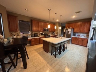 3110 Katner Lane Spring, TX 77386 - Photo 8 of 24 a kitchen with a sink a counter top space and stainless steel appliances
