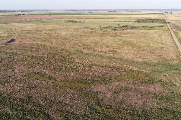 a view of a lake with a yard