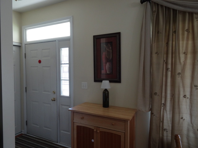 2318 Reflections Drive Aurora, IL 60502 - Photo 2 of 13 a bathroom with a sink a mirror and shower
