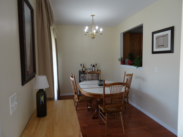 2318 Reflections Drive Aurora, IL 60502 - Photo 3 of 13 a view of a dining room with furniture and wooden floor
