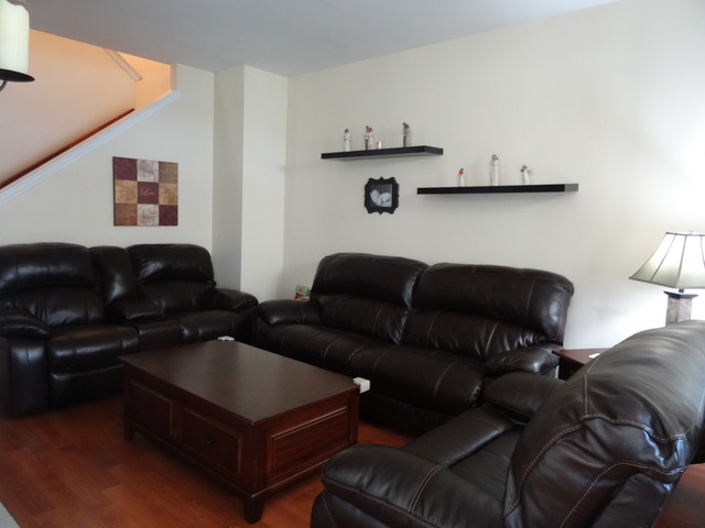 2318 Reflections Drive Aurora, IL 60502 - Photo 4 of 13 a living room with furniture and a couch