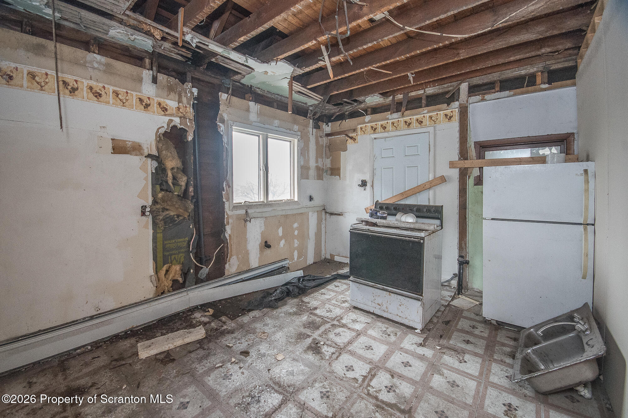 922 West Elm Street Scranton, PA 18504 - Photo 26 of 29 a kitchen with a stove and a refrigerator