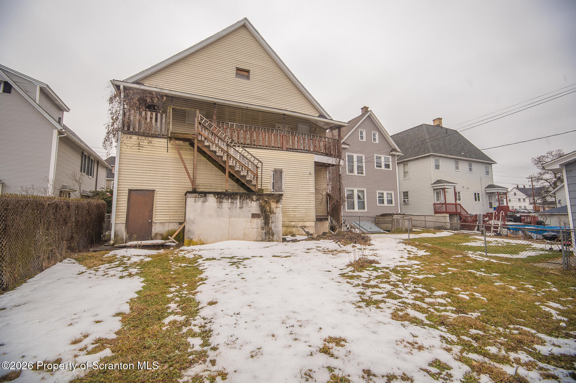 922 West Elm Street Scranton, PA 18504 - Photo 28 of 29 a view of a house with a yard covered in snow