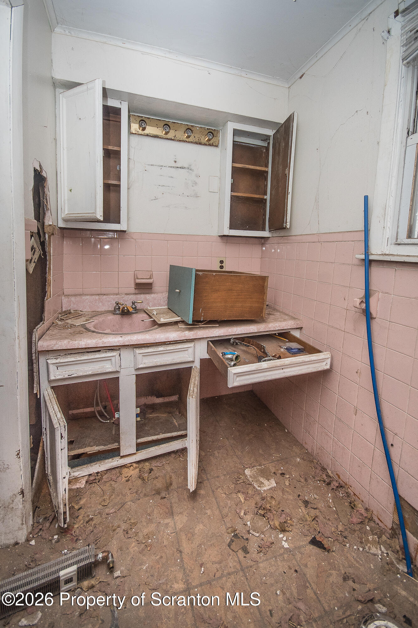 922 West Elm Street Scranton, PA 18504 - Photo 10 of 29 a bedroom with a bed and a desk