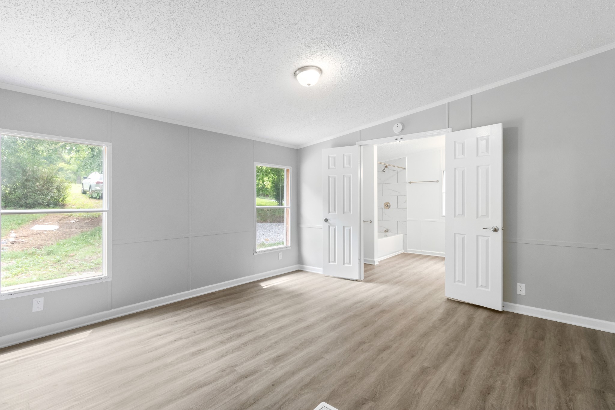 2177 Highway 76 Adams, TN 37010 - Photo 18 of 23 a view of empty room with wooden floor and fan
