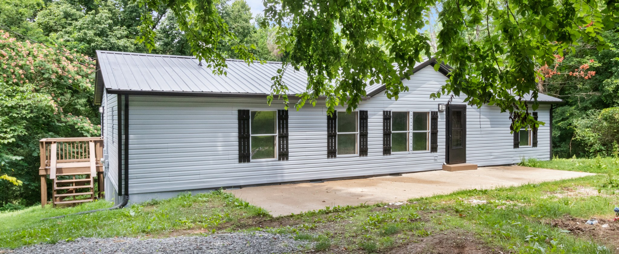 2177 Highway 76 Adams, TN 37010 - Photo 7 of 23 front view of a house with a yard