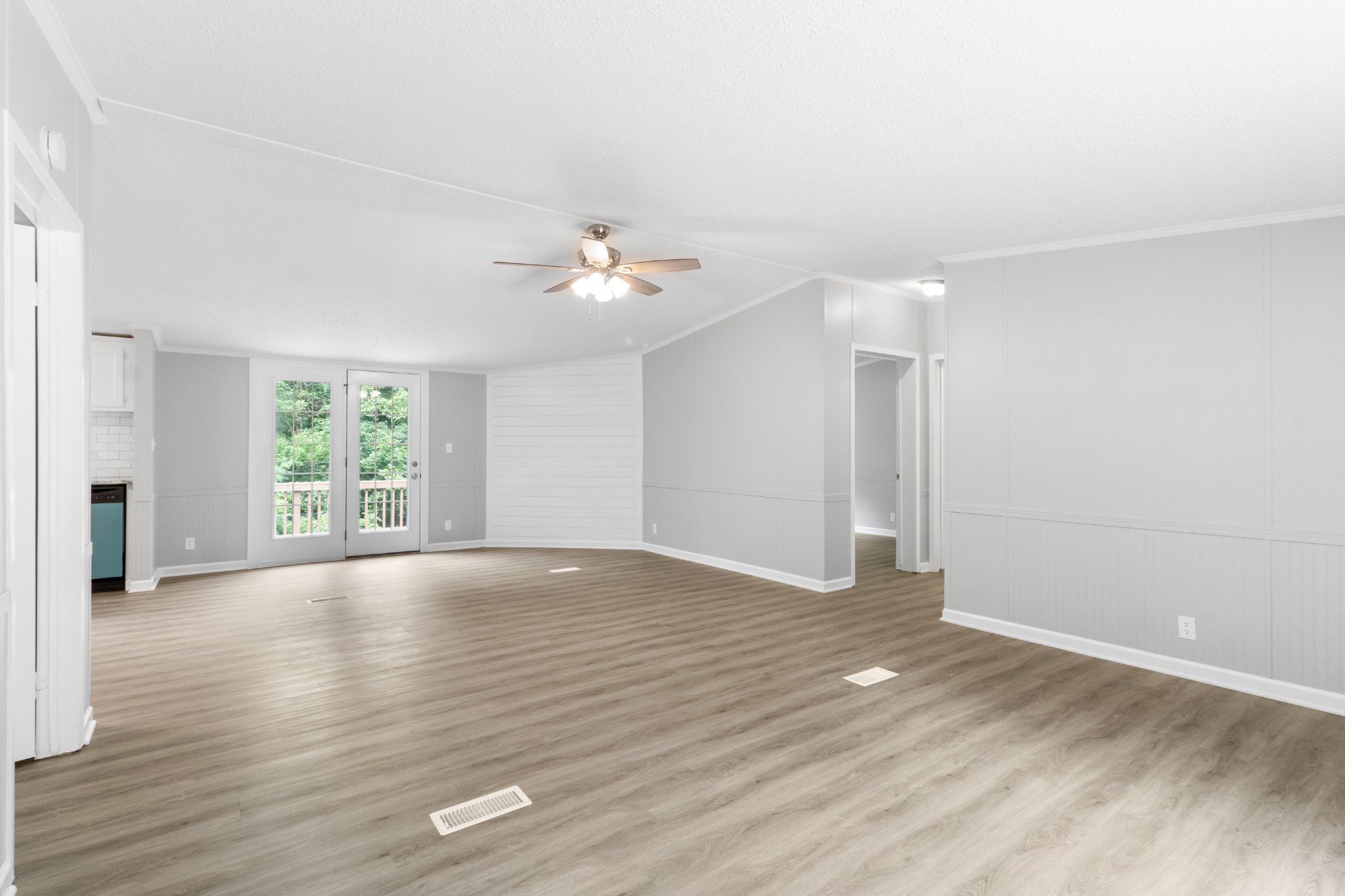 2177 Highway 76 Adams, TN 37010 - Photo 9 of 23 a view of an empty room with wooden floor and a window