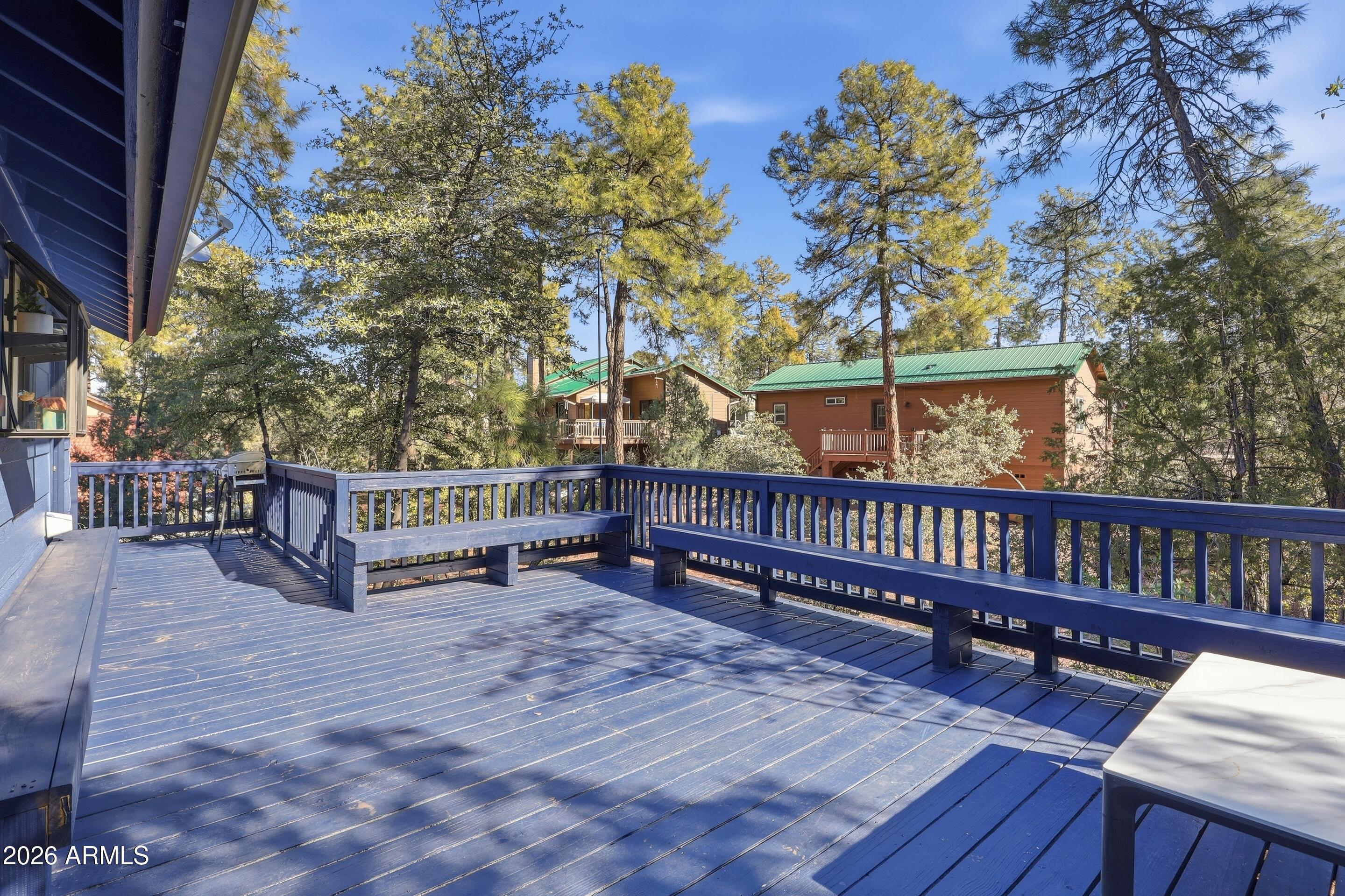 201 North McLane Road Payson, AZ 85541 - Photo 22 of 42 a view of a roof deck with wooden fence and floor