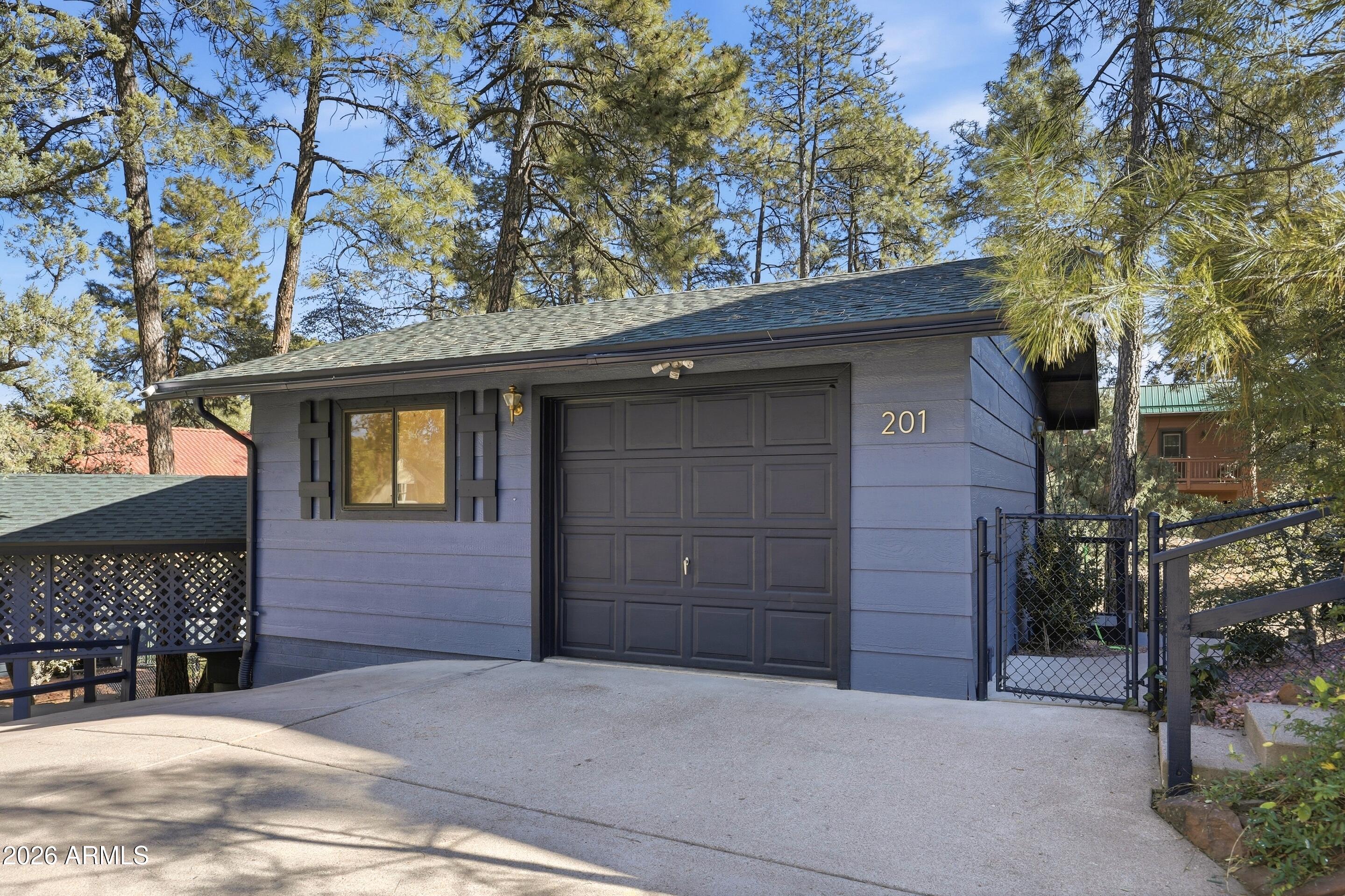 201 North McLane Road Payson, AZ 85541 - Photo 35 of 42 a front view of a house with a tree