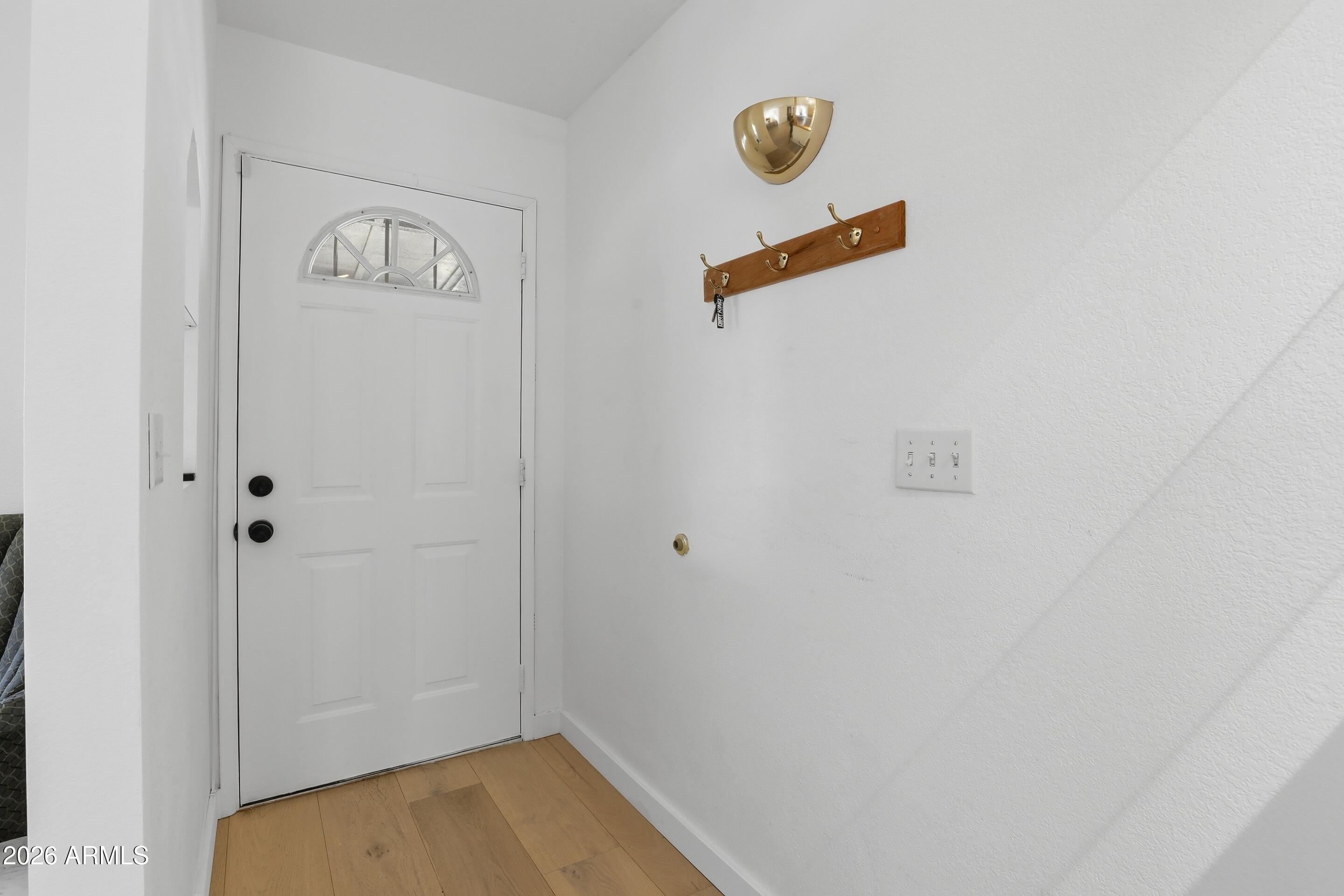 201 North McLane Road Payson, AZ 85541 - Photo 4 of 42 a view of a hallway with paintings on the wall