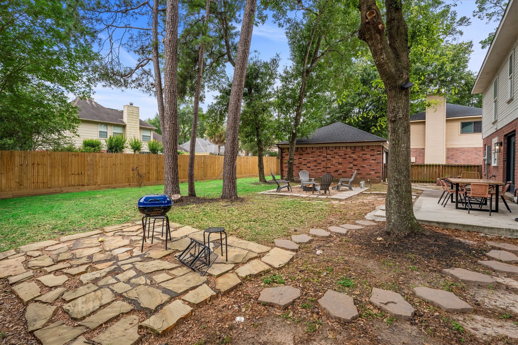 503 Alley Court Spring, TX 77388 - Photo 11 of 48 a garden with a bench and trees