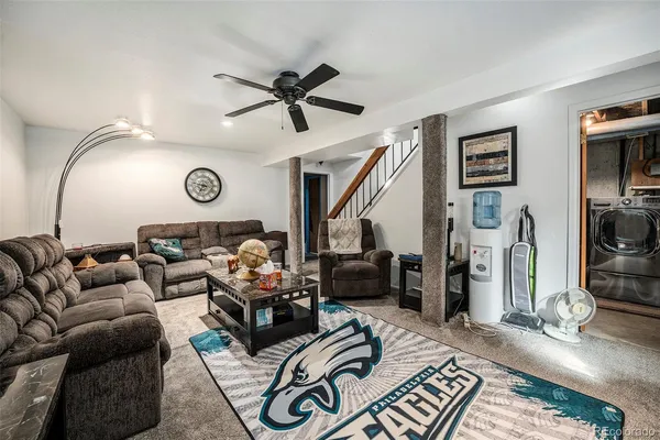 a living room with furniture and a window