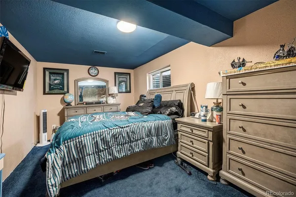 a bedroom with a bed and furniture