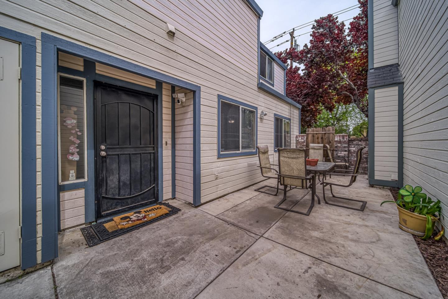 a view of a house with backyard and sitting area