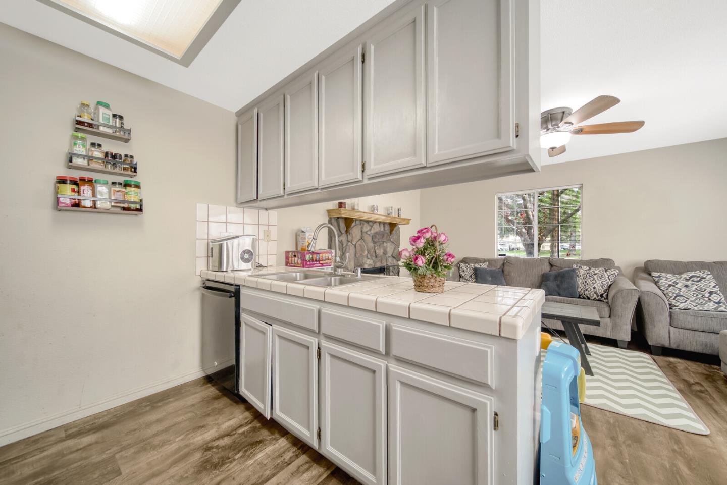 440 Golf Circle Manteca, CA 95337 - Photo 14 of 31 a kitchen with stainless steel appliances granite countertop a sink and cabinets