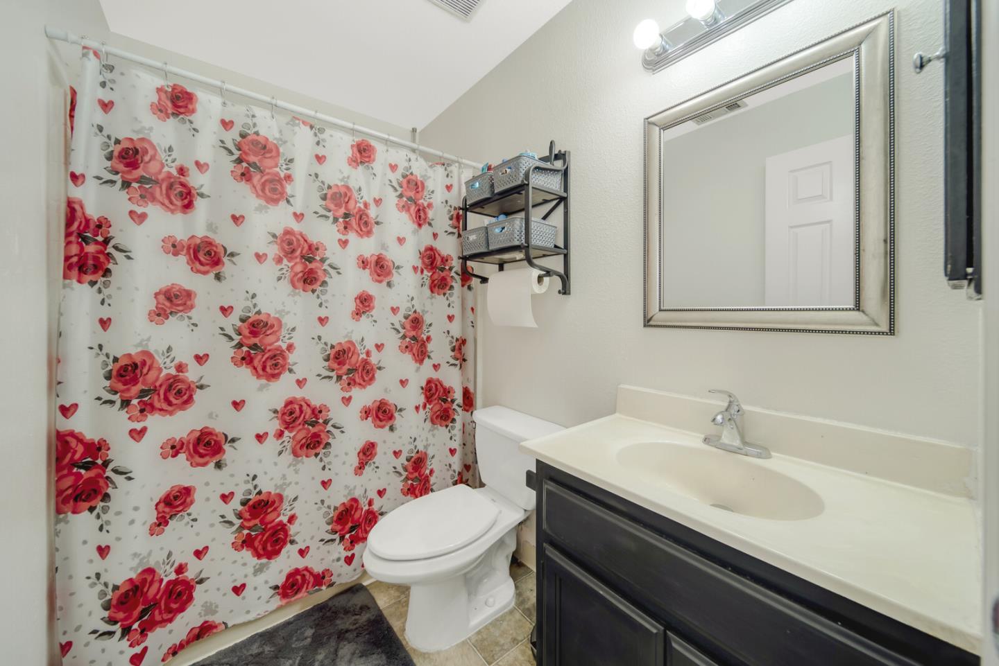 440 Golf Circle Manteca, CA 95337 - Photo 17 of 31 a bathroom with a sink toilet and shower