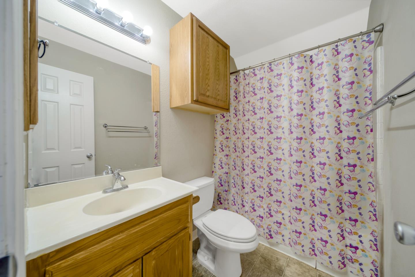 440 Golf Circle Manteca, CA 95337 - Photo 22 of 31 a bathroom with a sink toilet and mirror