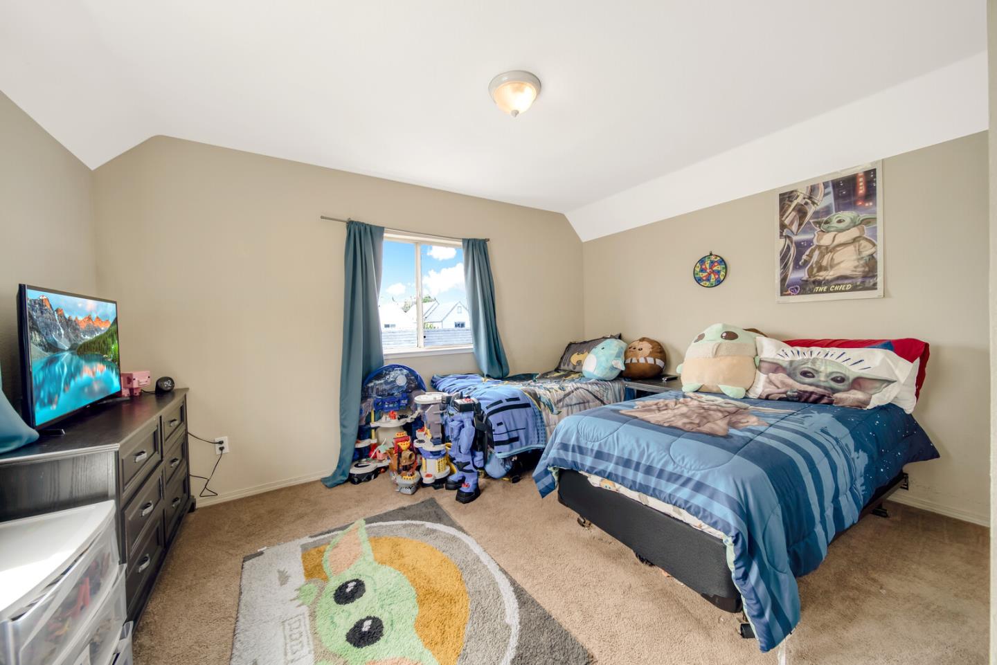 440 Golf Circle Manteca, CA 95337 - Photo 25 of 31 a bed room with a bed and a flat screen tv