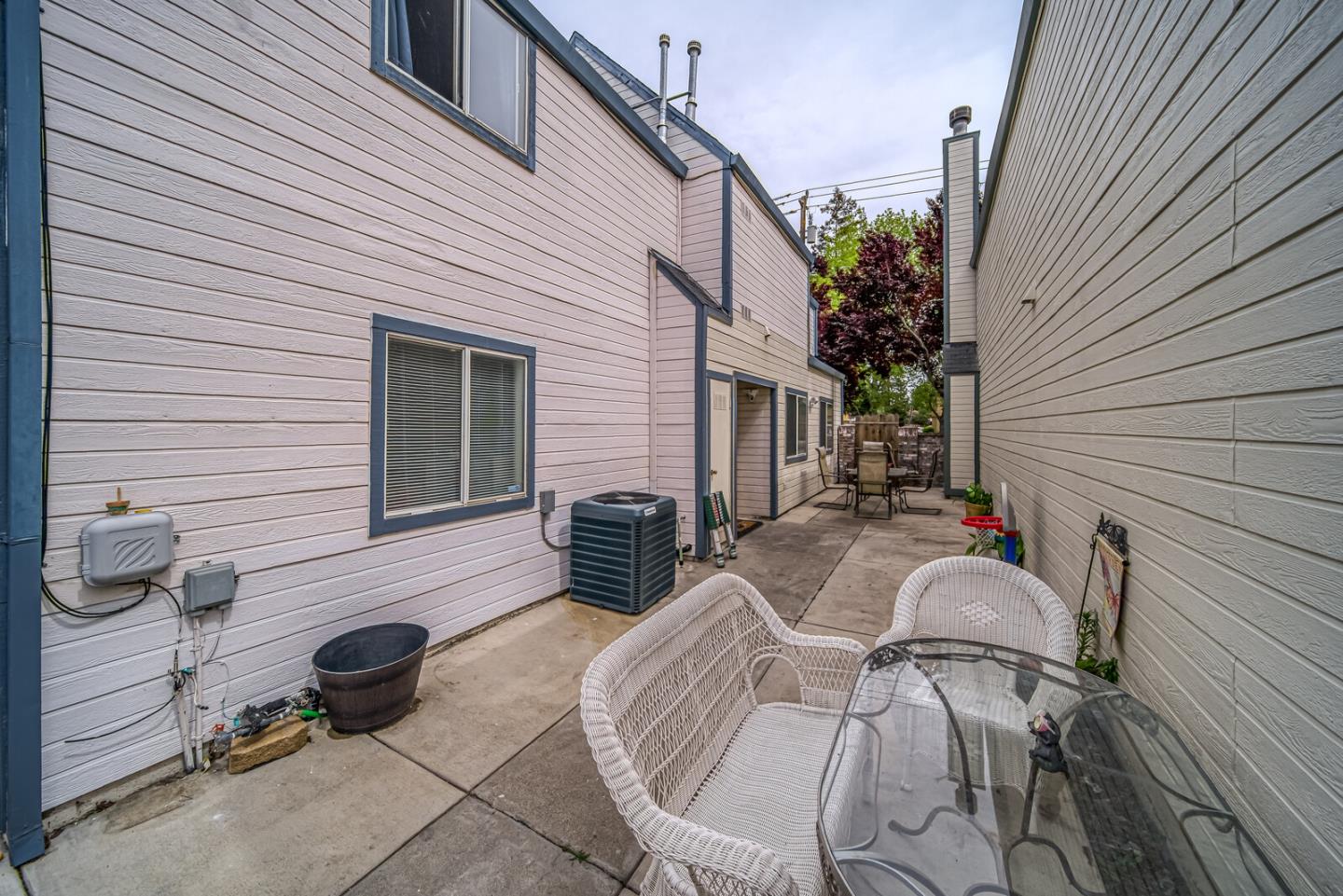440 Golf Circle Manteca, CA 95337 - Photo 6 of 31 a view of a patio with couches chairs and potted plants