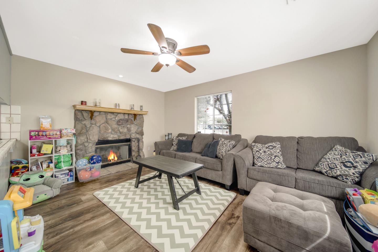 440 Golf Circle Manteca, CA 95337 - Photo 9 of 31 a living room with furniture and a fireplace