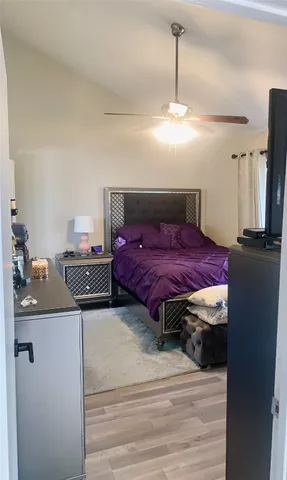 a bedroom with a bed and cabinets