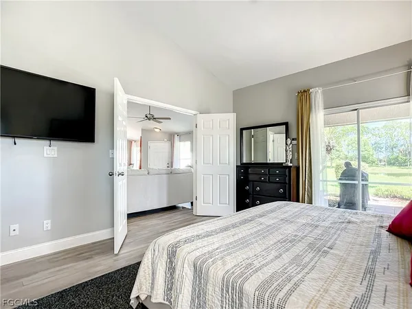 a room with a large window and a bed