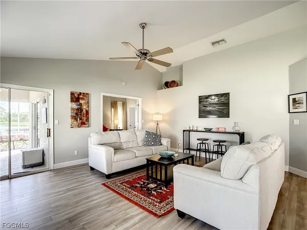 a living room with furniture and a rug
