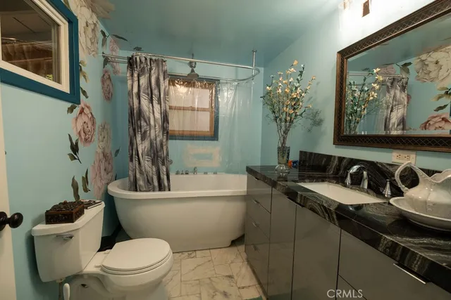 a bathroom with a toilet a sink and a bathtub