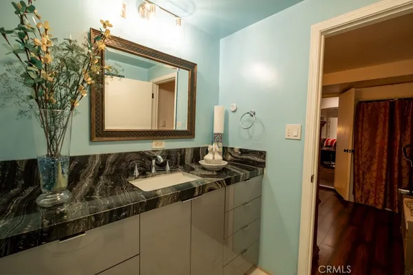 a bathroom with a sink and a mirror