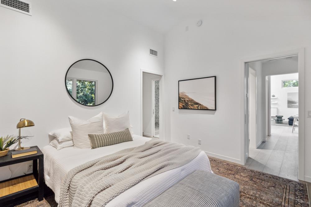 5312 Retreat Way Carmichael, CA 95608 - Photo 64 of 92 a bedroom with a large bed and a chandelier