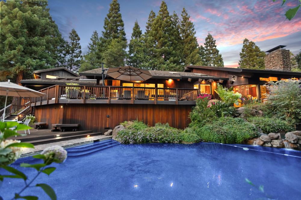 5312 Retreat Way Carmichael, CA 95608 - Photo 65 of 92 a backyard of a house with lots of green space and lake view