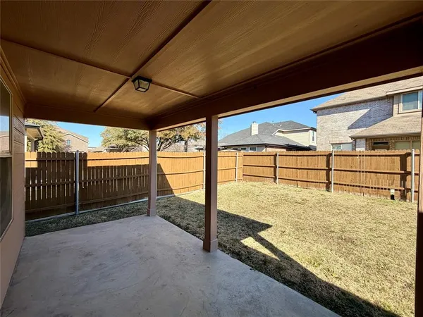 a view of a backyard of the house