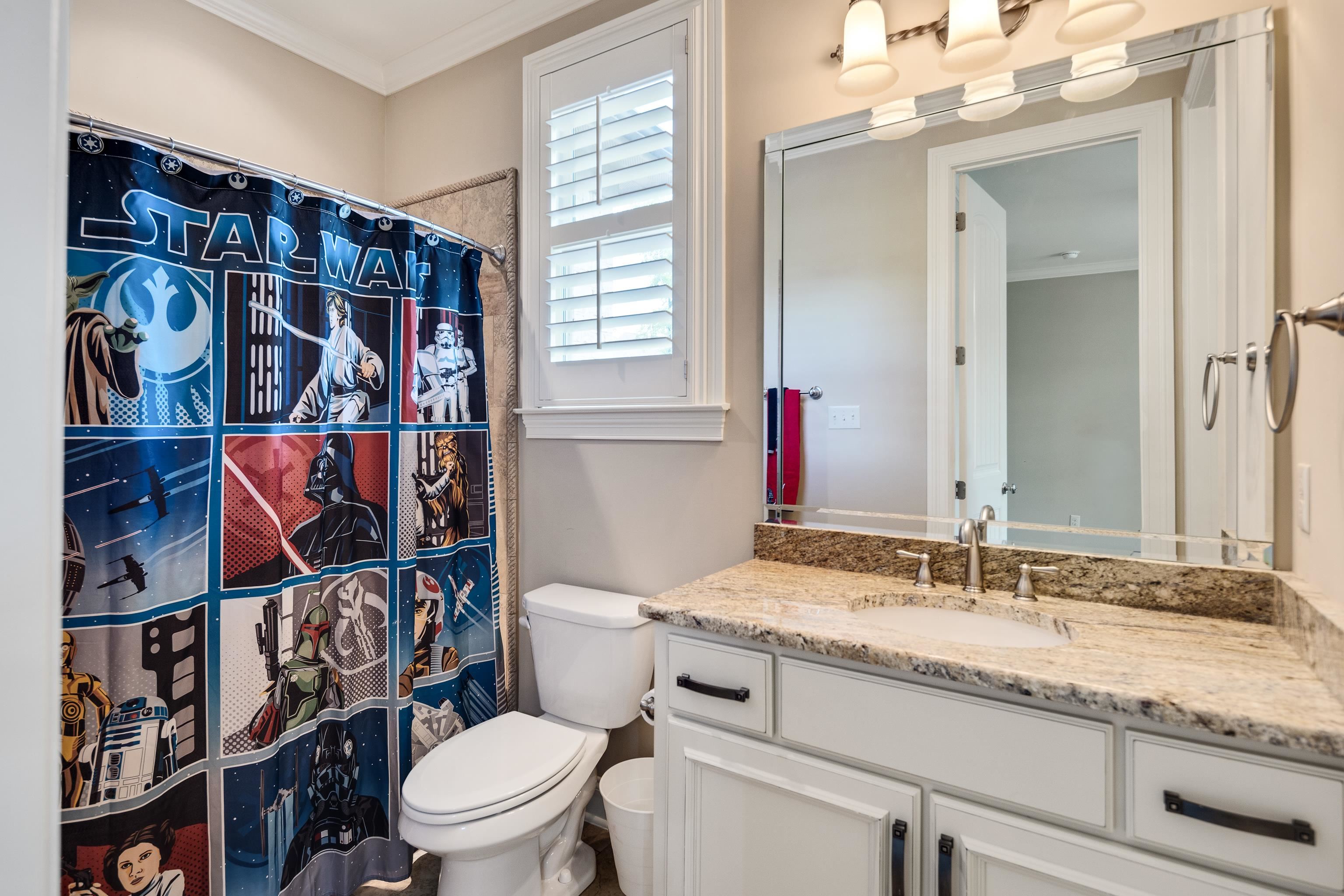 250 Ridgewood Drive Piperton, TN 38017 - Photo 20 of 36 a bathroom with a granite countertop sink and a toilet